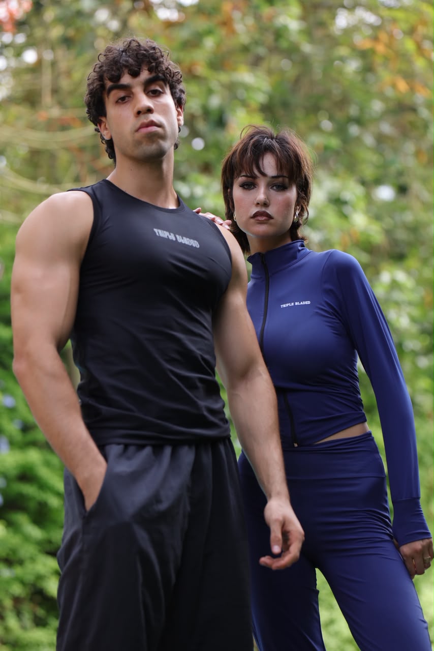 Navy flare set worn outdoors beside the black gym tank top