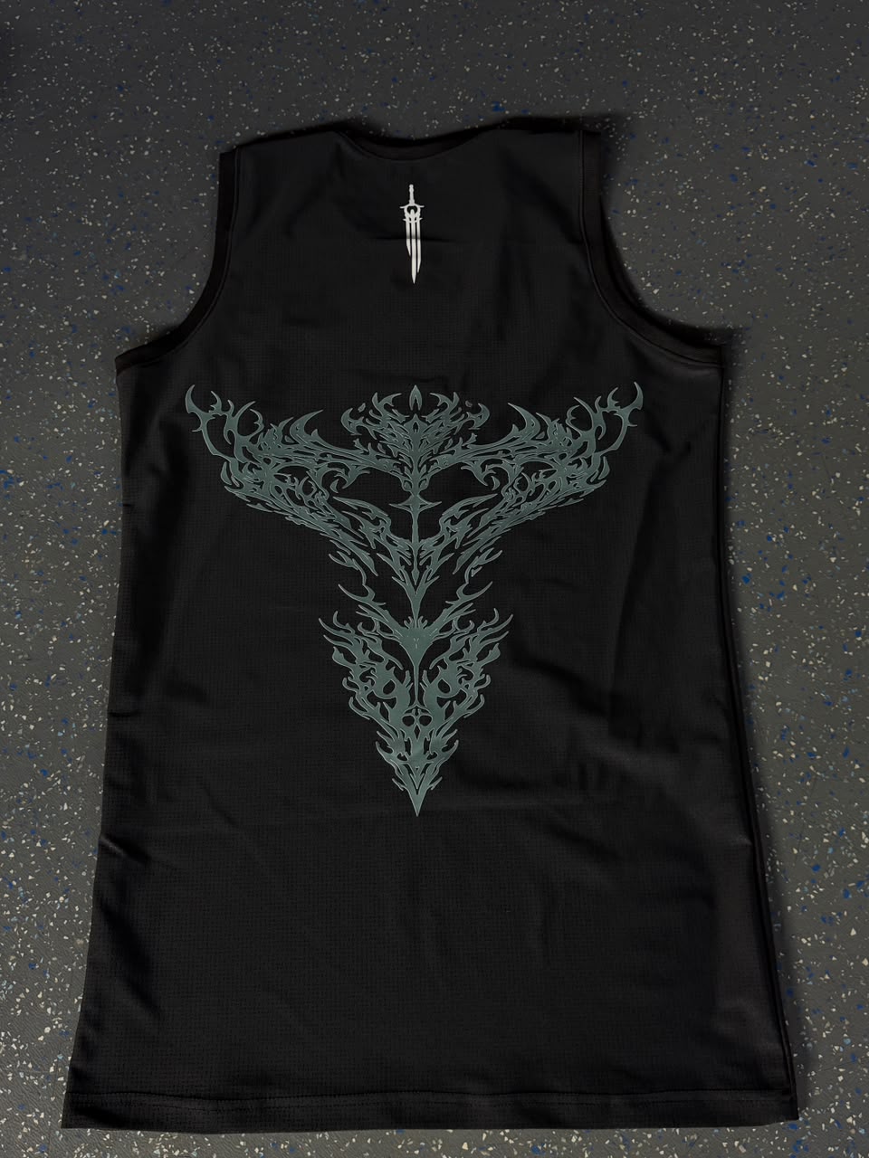 Men's Gym Tank Top laid flat, back thorn graphic